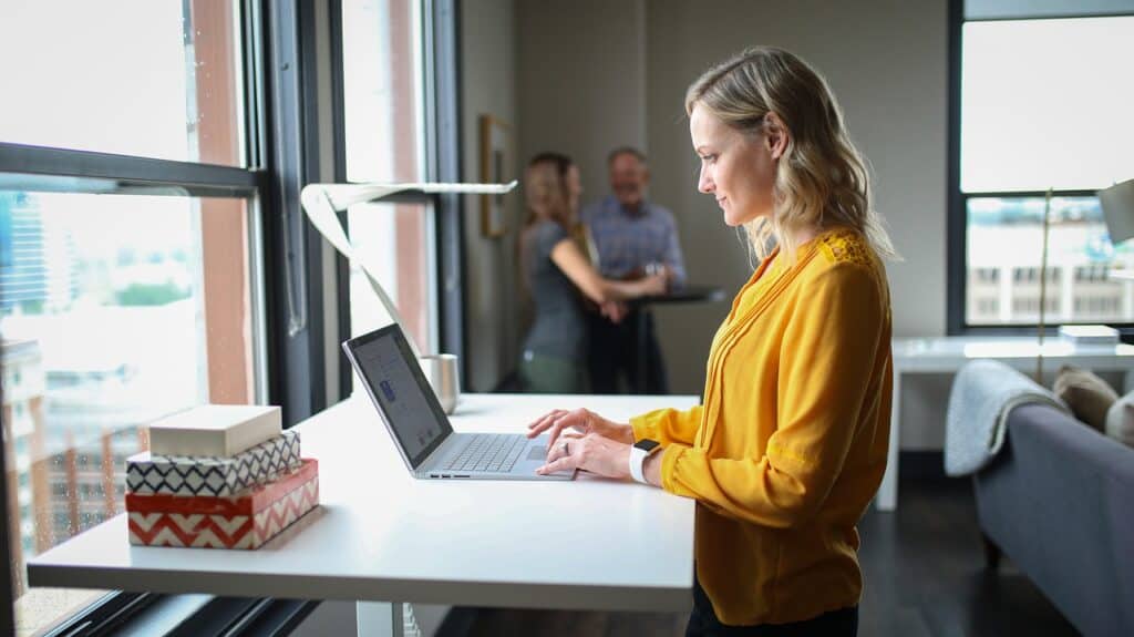 Woman working from home at a standing desk