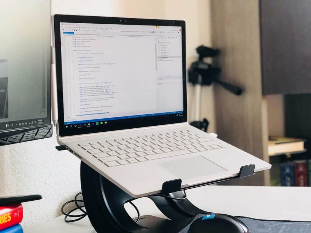 Laptop stand, one of many travel essentials for remote work