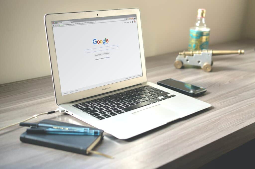 Google homepage on a laptop on a desk - Google search trends