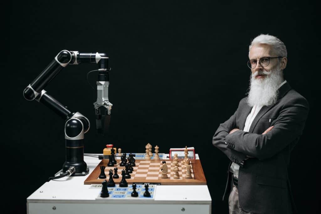 Person playing chess against an AI robot that user machine learning