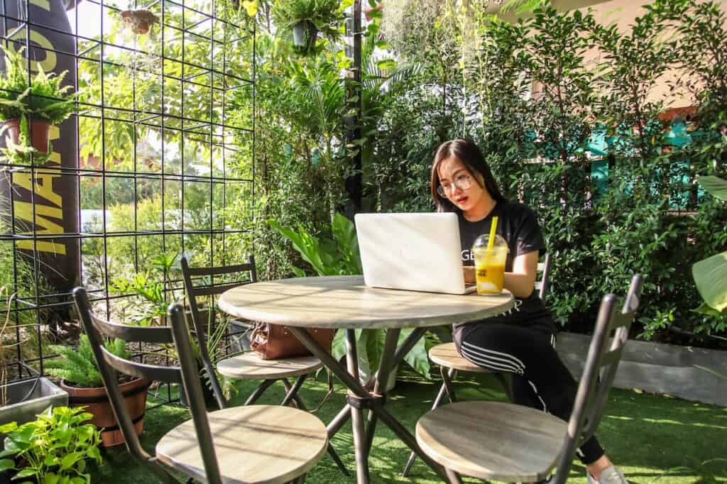 Digital nomad working outside on a laptop